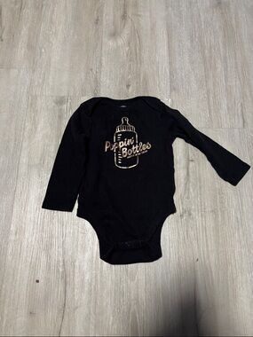 Old Navy Black Long-Sleeve Baby Bodysuit with Gold Bottle Graphic